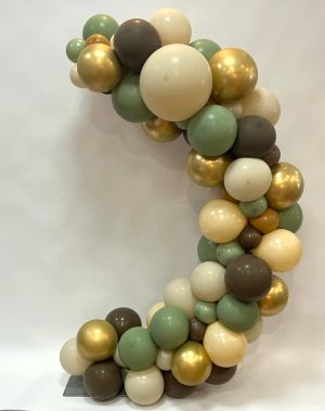 Green, white, brown and golden Balloons put together into a C-shape
